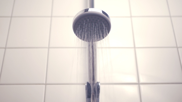 Bathroom - Water Flowing From the Modern Silver Shower Head