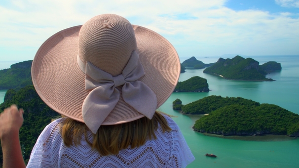 Female Traveler Enjoying View of Tropical Islands at Angthong National Marine Park in Thailand alt