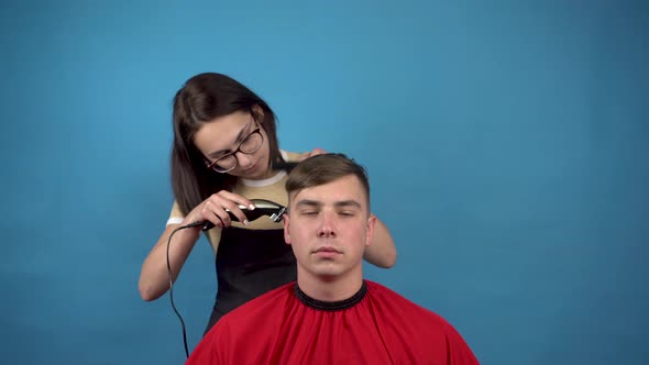 Hairdresser Hairstyle Spoiled Young Man. A Young Woman Accidentally Cut Off a Lot of the Hair on the alt