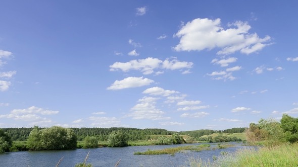 Landscape Against A Blue Sky With White Clouds. Time Interval, By Kenonl Play preview video - Landscape Against A Blue Sky With White Clouds. Time Interval, By Kenonl
