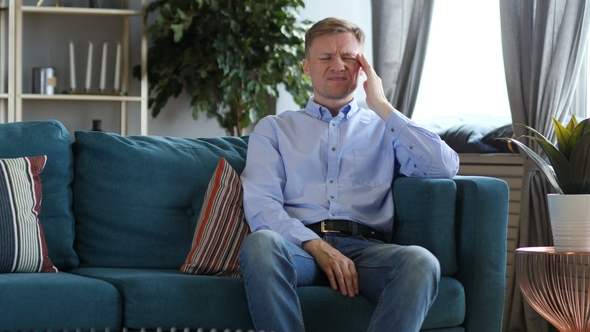 Tired Middle Aged Man Sitting with Headache, Pain alt