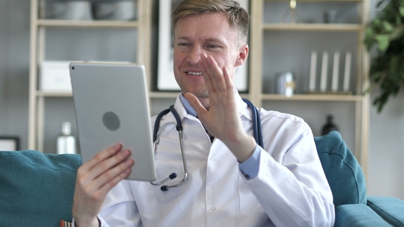 Doctor Sharing Good News on Video Chat on Tablet alt
