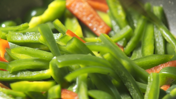 Delicious Colorful Vegetables Fry on Butter in Pan alt