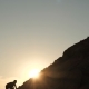 A Man Climbs the Slope of the Mountain at Sunset - VideoHive Item for Sale