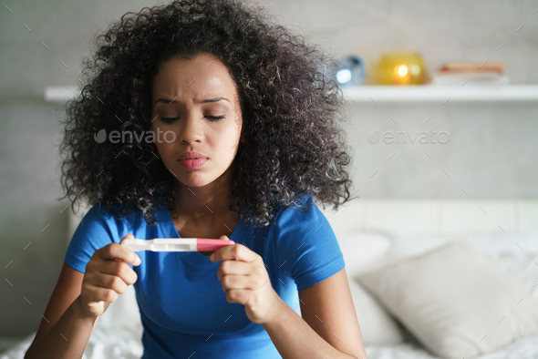 Sad Young Woman With Pregnancy Test At Home - Stock Photo - Images