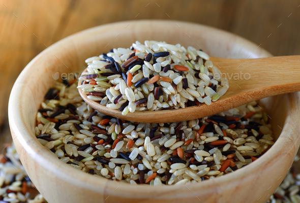 Brown rice seed in spoon Stock Photo by sommai | PhotoDune