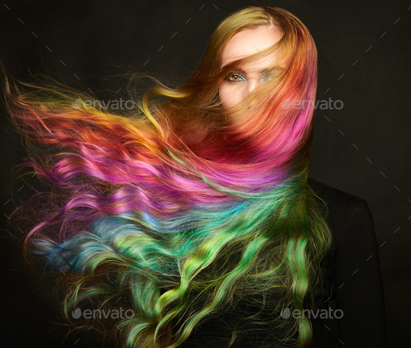 Portrait of young beautiful woman with long flying hair - Stock Photo - Images