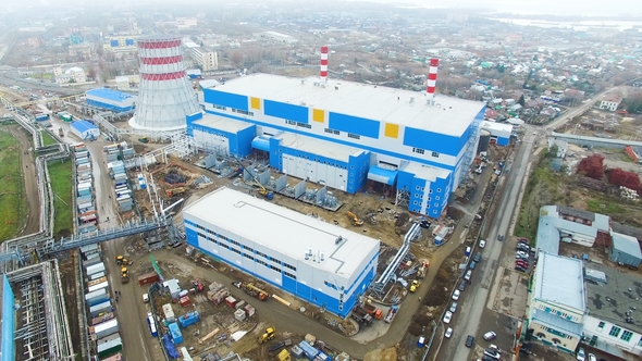 Thermoelectric Power Station Against City Covered with Fog alt