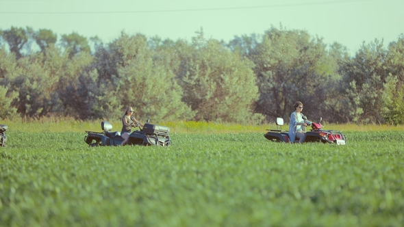 Friends Driving Off-road with Quad Bike or ATV alt