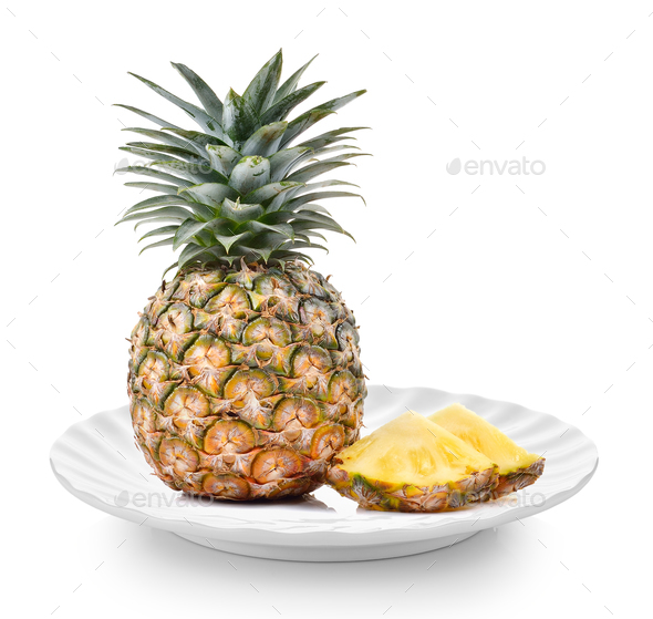 pineapple in white plate on white background Stock Photo by sommai