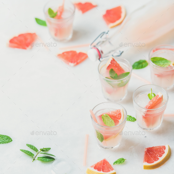 Cold refreshing alcohol cocktail with fresh grapefruit, square crop - Stock Photo - Images