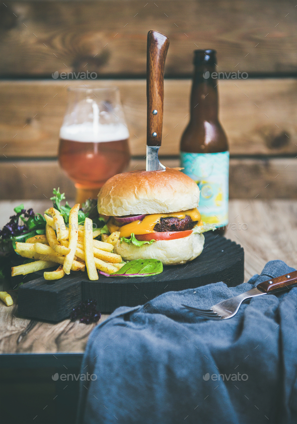 Classic burger dinner with beer and french fries, copy space Stock Photo by sonyakamoz