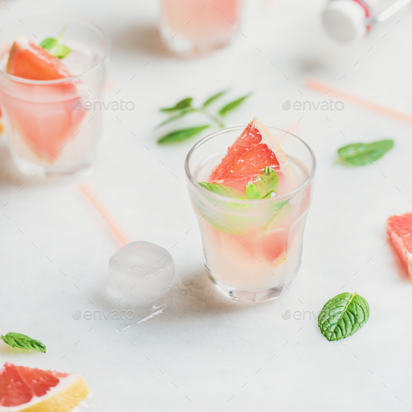 Cold refreshing summer alcohol cocktail with fresh grapefruit and ice - Stock Photo - Images