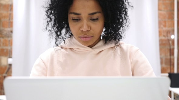 Portrait of Smiling Positive African Woman Working on Laptop alt