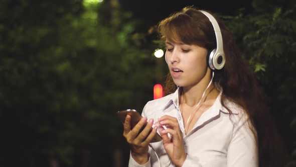 Girl in Headphones Includes Song in Touch Phone Waving Her Long Hair and Dancing Smiling and Kayfuya alt