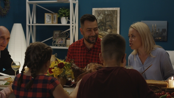 Cheerful Family Enjoying Thanksgiving Day Dinner alt