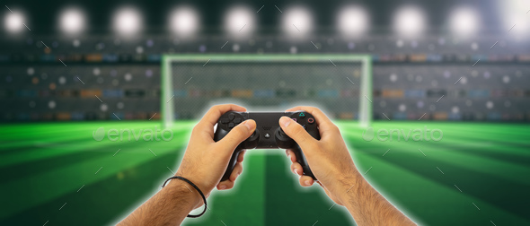 Male hands holding a video game controller on blur screen background Stock Photo by rawf8