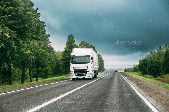 Truck Tractor Unit, Prime Mover, Traction Unit In Motion On Road Stock Photo by Grigory_bruev