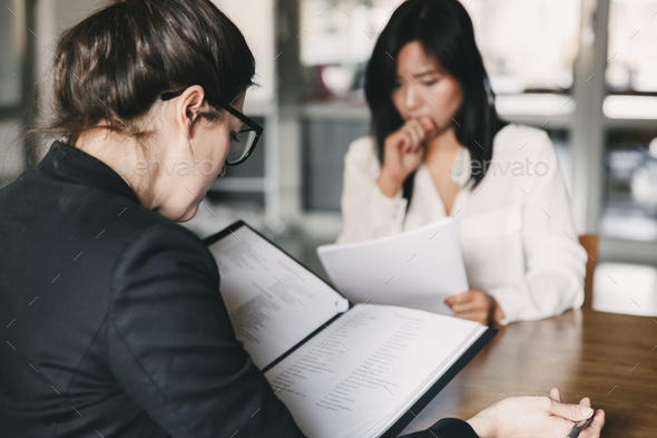 Photo from back of businesswoman interviewing, and talking with - Stock Photo - Images