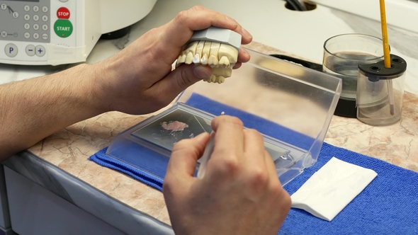 Dental Technician Drawings White Ceramics Glaze on Prosthesis of Teeth