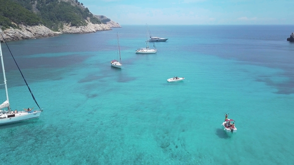 Amazing View To Yacht Sailing in Sea. Stock. Sunset View of the Yacht. Luxury Vacation on a Yacht alt