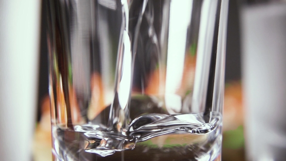 a Glass of Vodka on the Table with a Snack