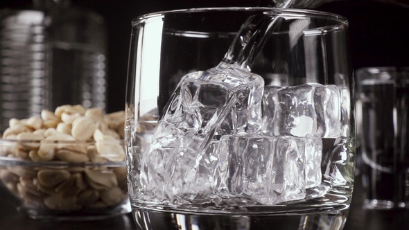 a Glass of Vodka on the Table with a Snack