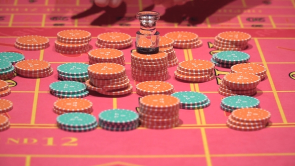 Dealer Working  Placing Bets Collect Chips for Roulette in Casino