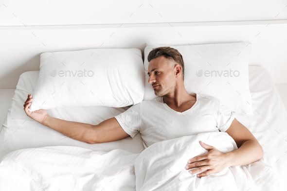 Sad Man Laying In Bed And Looking Away Stock Photo By Vadymvdrobot