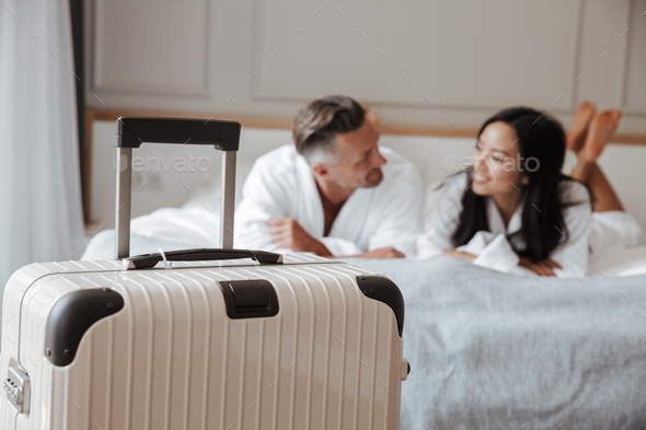 Image of blurry multiethnic couple man and woman wearing white b - Stock Photo - Images