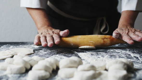 Woman Rolling the Dough By Hands alt