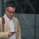 Man Walking and Using Smartphone - VideoHive Item for Sale