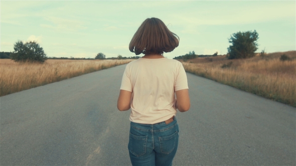 . Young Woman Running. Female Runner Jogging on Misty Road with the Early Morning at Sunrise with alt