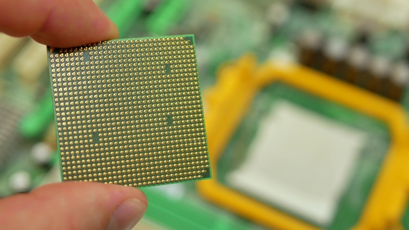 Hand of Computer Engineer Brings Computer Cpu Processor