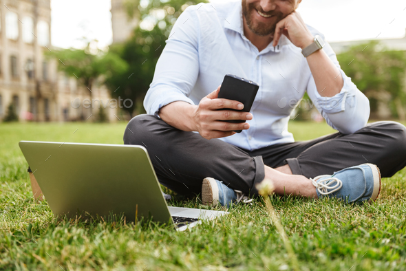 Cropped photo of caucasian smiling man in business clothing, sit - Stock Photo - Images