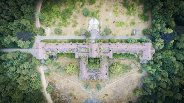 Aerial top view of abandon building in the forest