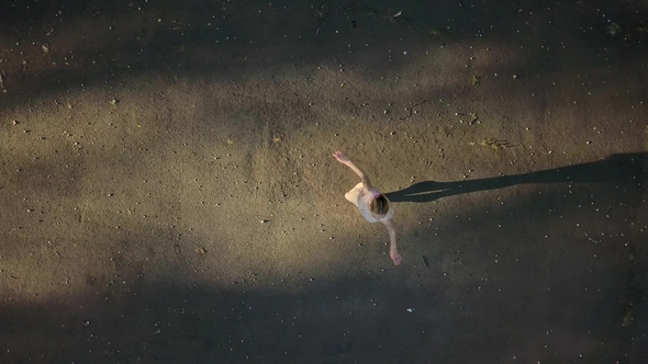 Pretty Ballerina Dancing Outdoors