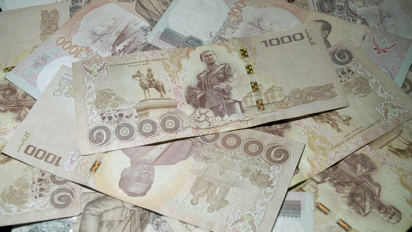 Thai Baht Banknotes Rotating on Turntable. National Currency of Thailand. Traditional Cash Money alt