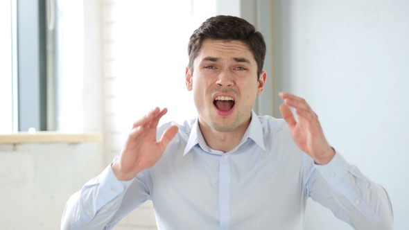 Upset Man Reacting To Failure in Office, Indoor alt