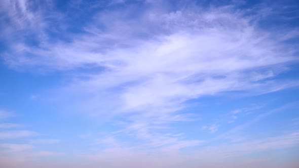 Blue sky with thin cirrus clouds timelapse, daytime landscape