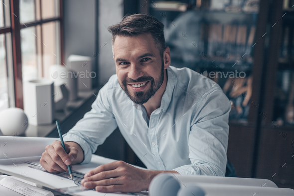 Smiling professional in the workplace Stock Photo by AboutImages | PhotoDune
