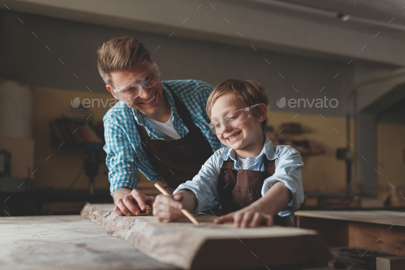Smiling father and son with glasses at work Stock Photo by AboutImages