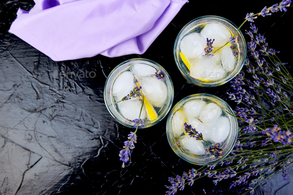 Lavender lemonade with lemon and ice - Stock Photo - Images