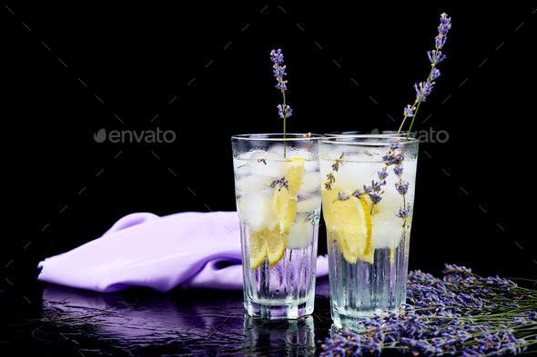Lavender lemonade with lemon and ice Stock Photo by bondarillia | PhotoDune