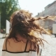 Young Hot Brunette Woman Seductively Plays with Her Hair, Smiles Straight To Camera, While Walking - VideoHive Item for Sale