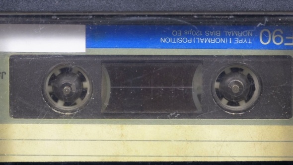 The Vintage Audio Cassette in the Tape Recorder Rotates alt