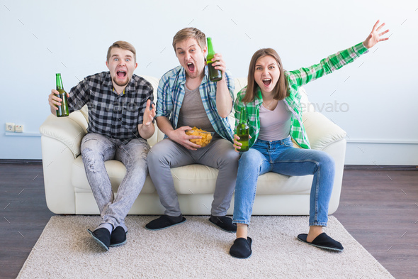 Soccer world cup, friends with chips and beer watching sports at home Stock Photo by Satura_