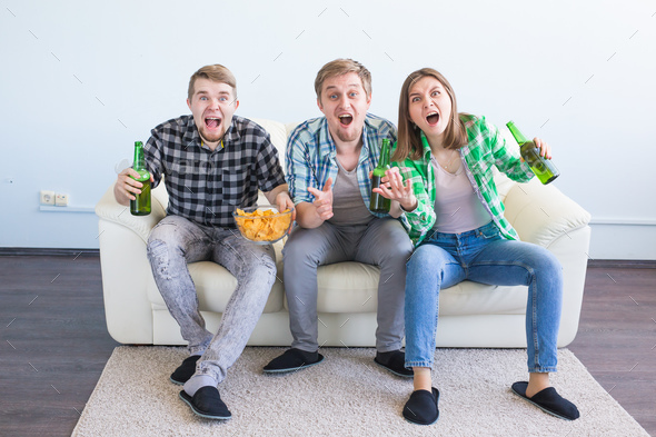 Soccer world cup, friends with chips and beer watching sports at home Stock Photo by Satura_