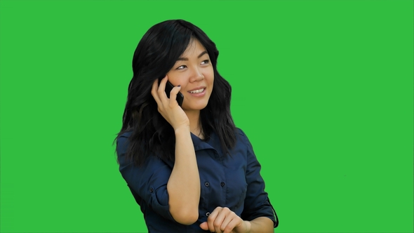 Happy Asian Woman Talking on a Cell