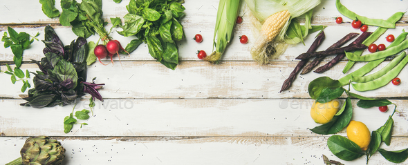Healthy raw summer vegan ingredients over white wooden background - Stock Photo - Images